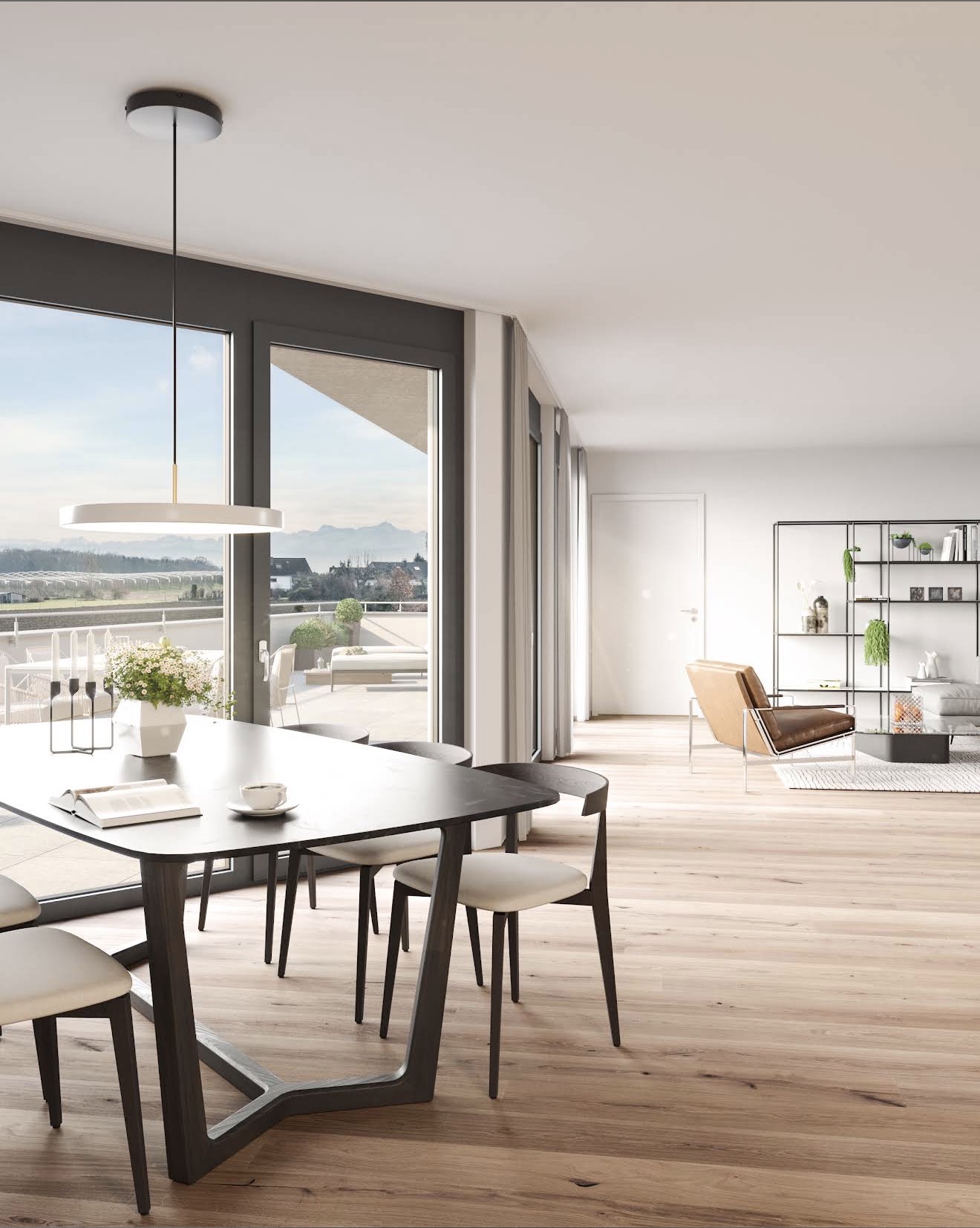 Heller Wohn- und Essbereich einer fertiggestellten Wohnung mit Blick auf die Alpen
